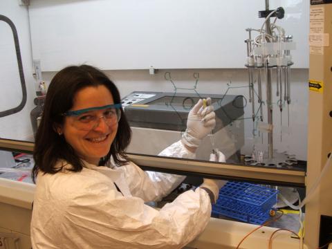 Rachel Marek poses for a photo while working in the lab